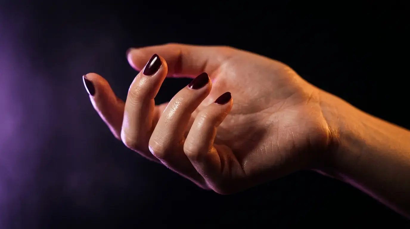 Seven abstract hand grip icons arranged in a grid with neon amber and purple glow on dark background